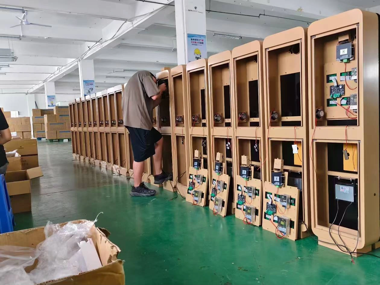 A team member assembling internal equipment components in the workshop